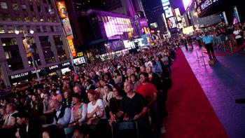Audiences watch the opening night of the Met Opera in Times Square.